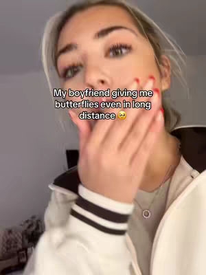A young woman with fair skin and light-colored hair covers her left cheek with her manicured right hand. The overlay text is in a casual, friendly font.