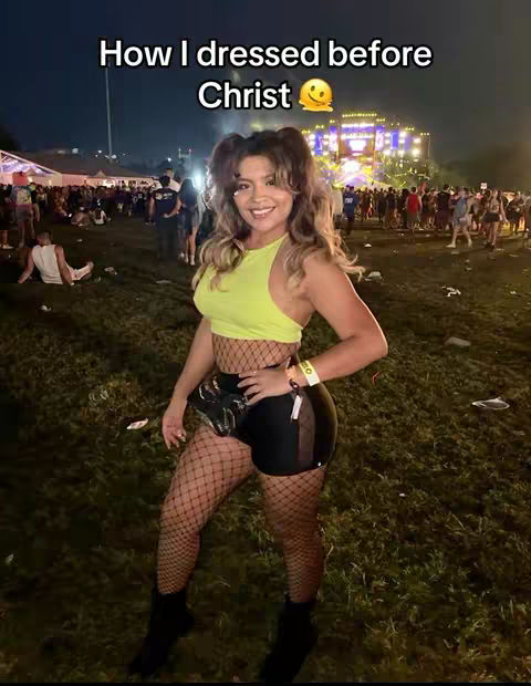 A woman stands smiling in front of a crowd at an outdoor event at night, wearing a revealing outfit and looking at the camera. Text across the top reads, How I dressed before Christ.