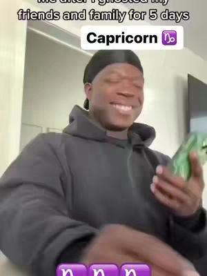 A man with dark skin and a black durag smiles, holding a green-cased phone. Overlay text labels the image as a Capricorn meme.