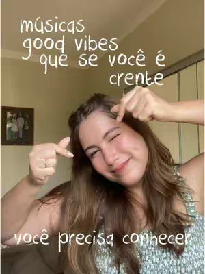 A selfie-style shot featuring a young woman with long brown hair. She is smiling and pointing her index fingers towards her forehead. The text overlay consists of white handwritten-style words. The background is a softly lit interior, possibly a home setting.