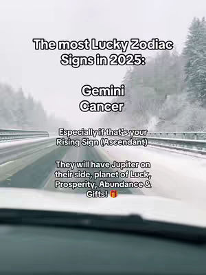 The cover image shows a view from inside a car traveling on a snow-covered road. The road is the primary focus, with snow-covered trees and the sky visible in the background. Text overlays the image, detailing lucky zodiac signs for 2025.