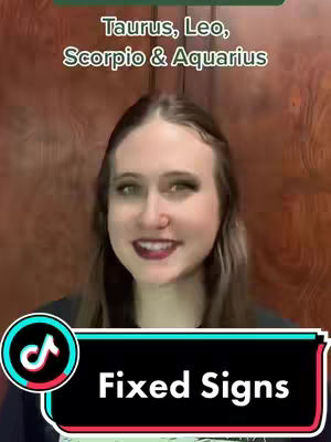 A woman with long brown hair smiles at the camera. The background is a wooden wall. Overlayed text at the top says 'Taurus, Leo, Scorpio & Aquarius'. The tiktok logo is at the bottom left corner. A text box at the bottom with the text 'Fixed Signs'.