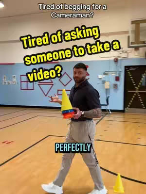 The cover image depicts a man standing in a gymnasium holding training cones. Text overlays are used over the whole image.