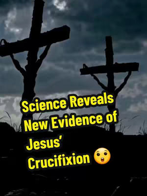 A dark, dramatic image depicts a silhouetted landscape with two crosses on a hill under a cloudy sky. The foreground is dark, with grassy areas, and the background shows a stormy sky. Text overlays in yellow font read \"Science Reveals New Evidence of Jesus' Crucifixion\" and a shocked face emoji.