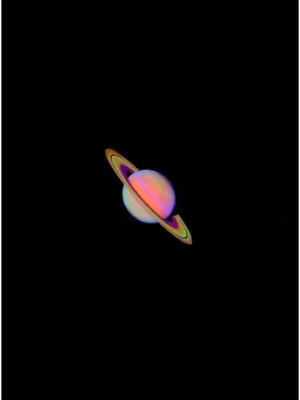 The cover image features the planet Saturn, depicted in a colorful and detailed illustration against a deep black background. The planet is shown with its characteristic rings, which are rendered in a gradient of pink, orange, and yellow. The planet itself has a pale pink color, and the lighting suggests a celestial glow. The overall composition is simple yet striking, with the planet centered, creating a sense of cosmic isolation and grandeur.