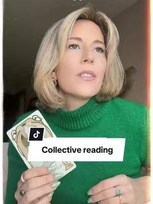 A woman with blonde hair and a green sweater holds a tarot card. A white rectangle with the text "Collective reading" is visible and attached to the lower-left of the card. The woman is set against a light-colored backdrop.