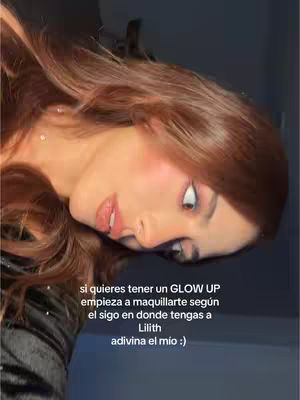 The cover image shows a young woman with long, reddish-brown hair, her face tilted towards the lower left corner. She has pale skin, pink blush on her cheeks, and full, glossy lips. Her right eye is open, and her gaze appears focused upward, with a slightly raised expression. Casual black top is visible on the left side. Text in white font is overlaid on the bottom third of the image.