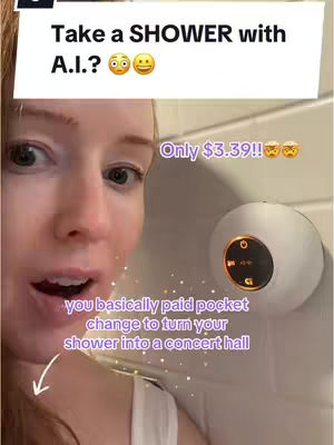 A woman's face fills most of the frame, her expression a mixture of surprise and excitement. Above her, text in a white box asks a question, followed by emojis. Off to the right, a white, circular waterproof speaker is mounted on a white tiled wall, and more text appears. The composition is bright, with neutral tones.