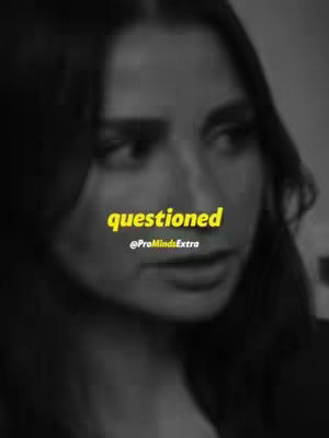 A grayscale image shows a woman's face, slightly blurred, with the text 'questioned' in a vibrant yellow overlayed near the center. The text below reads '@ProMindsExtra'.