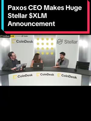 The image shows a panel discussion during a CoinDesk Live event. Three people are seated behind a curved table with the CoinDesk logo. The backdrop features the Stellar logo. The foreground has text overlayed at the top, 'Paxos CEO Makes Huge Stellar $XLM Announcement'.