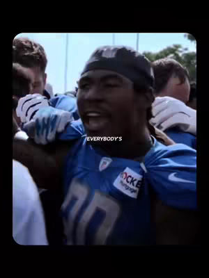 The cover image features a close-up of a Black football player in a blue jersey. The player has an excited expression with his mouth open, as if he's yelling. The jersey has the number 70 on the front and a logo for "Rocket Mortgage".