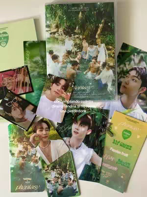 A collection of photocards, cards, and album artwork arranged on a white surface. The layout includes various photos featuring people, primarily young men, some in groups and some in individual shots. The color scheme is verdant with shades of green. The overall composition is a flat lay, with the elements spread out to create a collage-like effect.