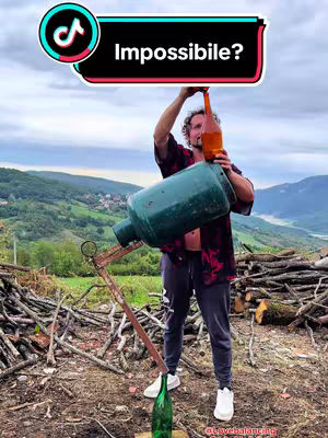 A cover image shows a man in a rural setting attempting to pour liquid from a large, green container into a bottle. The man is holding a bottle in one hand, and the large container above it. The word "Impossible?" is placed above the man.