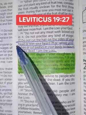 A camera angle focuses on an open book with a highlighted bible verse, overlaid with text suggesting Leviticus 19:27. A pen partially obstructs the view, drawing attention to the highlighted text.