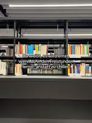 A shot of a library with bookshelves filled with books. Text is overlaid at the bottom of the image.