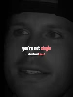 A close-up view of a person's face, centrally positioned, with the eyes focused forward. The background is dark and blurry. The image has a slightly grainy texture. Bold, white text overlays the person's face, with the words 'you're not single,' and some of the word 'single' is accented in pink. Beneath this is text featuring '@EmotionalLines.1'.