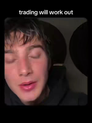 The cover image shows a close-up of a young man with short dark hair and closed eyes. The text overlay reads, 'trading will work out'. The background is dark and out of focus.