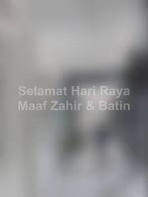 A blurred image with text overlayed. The background is a gradient of gray and white, and the central focus is the text in a light gray color. The text reads 'Selamat Hari Raya Maaf Zahir & Batin'.
