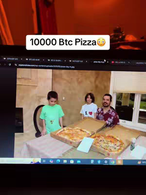 A man stands with two children in front of a table with two open pizza boxes. The words "10000 Btc Pizza" are overlaid at the top.