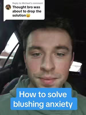 A man is centered in the shot, framed from the chest up. He has short brown hair, and he is wearing a green hoodie. A blue rectangle at the bottom of the image contains the overlaid text 'How to solve blushing anxiety'. In the top left corner is a comment bubble with the text: 'Thought bro was about to drop the solution.'