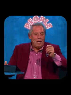 A man in a red jacket is speaking in front of a blue backdrop, a neon sign above his head reads "PEOPLE". A table with a small screen sits near him.