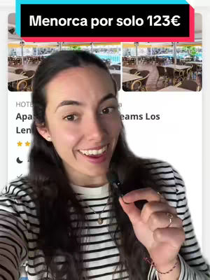 A woman in a striped shirt holds a small object with her fingers, smiling at the camera. Above her is a text overlay that reads "Menorca por solo 123€". Behind the text overlay a picture of a restaurant with tables and chairs.