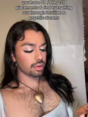 The image features a person with long dark hair, makeup, and a neutral expression. They wear a necklace with a heart pendant. Overlayed text describes psychic intuition.