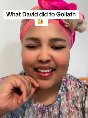 A woman with dark skin and a headscarf smiles, the frame focuses close on her face and the text overlay shows 'What David did to Goliath'.