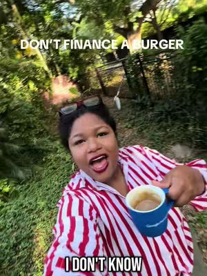 The cover image shows a selfie of a Black woman looking directly at the camera with an open mouth, as if mid-sentence. She's holding a blue mug with a dark beverage. She's wearing glasses on top of her head and a red and white striped shirt. Text overlays are added to the image.
