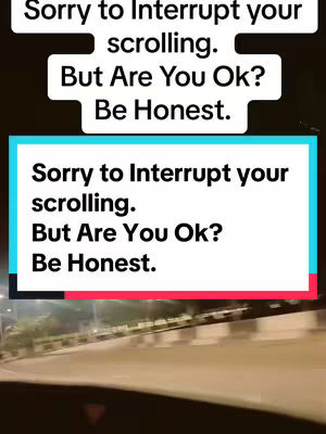 The cover image shows a night-time street scene with blurry lights and passing vehicles. Two text overlays are on the screen, one in the lower half that prompts the viewer with a question, "But Are You Ok? Be Honest."