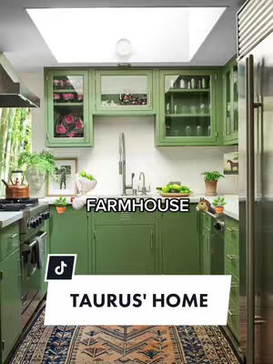 A kitchen with green cabinets, a white sink, and a rug. A sign says "Farmhouse", and below that, there is a sticker with the TikTok logo and the text "TAURUS' HOME."