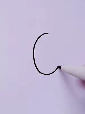 A hand draws a curved line with a black marker on a white surface. The line forms a portion of a circle, with the marker's tip positioned at the endpoint, and the background is plain white.