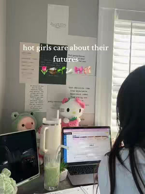 The cover image shows a desk setup. A laptop displays a webpage, a tablet set to the left, and a glass of green liquid sits in front. Decorative plush toys and stationery are also visible, and in the foreground, a portion of a person's hair is captured. The background includes a wall with printed papers.