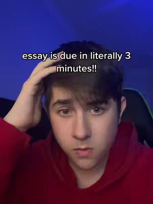A young man with brown hair is shown in a close-up shot, looking directly at the camera with a concerned expression. Text overlayed on the image states, "essay is due in literally 3 minutes!!" The background is a gradient of dark blue.