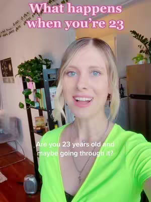 A woman with blonde hair and blue eyes is speaking, with the text 'What happens when you're 23' above her head. The background includes indoor plants and furniture.