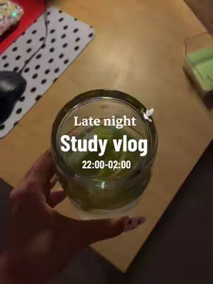 The cover image features a top-down view of a desk setting with a glass of green liquid, framed by a hand. The text overlay reads: 'Late night study vlog 22:00-02:00.' Surrounding elements include a mousepad, a mouse, and a corner of a green container.