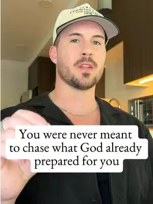 A man wearing a baseball cap and black shirt is centered in the frame, speaking directly to the viewer. A white rectangular text overlay is positioned near his hand, containing the video's hook.