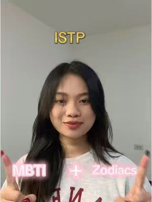 A woman with black hair and a white t-shirt is centered in the frame. Above her head, the word "ISTP" is overlaid in a gold, slightly shadowed font. Below, the text "MBTI + Zodiacs" is displayed with a glowing pink outline. She's giving a peace sign with both hands.