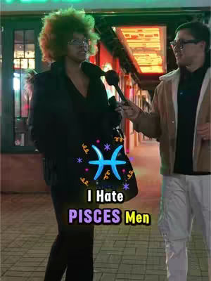 The image captures a street interview scene at night. A woman with curly hair and glasses, dressed in a dark outfit, is in the foreground being interviewed. In the background, a man in a tan jacket is holding a microphone. The overlaid text graphic includes the phrase "I Hate PISCES Men" with a Pisces symbol designed in the center.