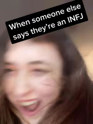 The cover image is a blurry, close-up shot of a woman's face. She is wearing bright eye makeup and has her mouth open as if she is shouting or laughing. Above her is a black box with white text.