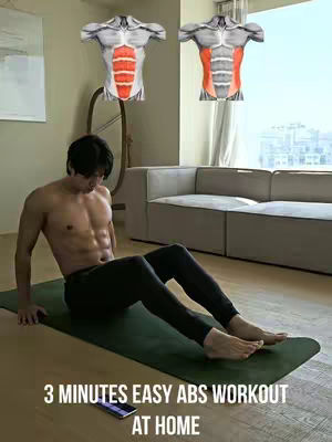 A man is lying on a green exercise mat, shirtless, with his abs prominently visible. Two graphic depictions of a male torso displaying abdominal muscles are floating behind him. The background includes a room with a couch, window, and what appears to be an artistic metal structure. Below the man is a phone, and text reads "3 MINUTES EASY ABS WORKOUT AT HOME".