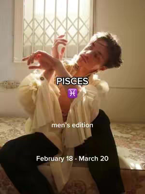 A man with light skin is seated on a bed with ornate patterned fabric, dressed in an off-white, loose-fitting shirt with ruffled details, and black pants. His pose is dynamic, with arms raised and a slightly upward gaze. The background has a window with a decorative screen and an overall warm, well-lit environment. Text overlays include "PISCES" at the top, Pisces symbol, "men's edition", and "February 18 - March 20".