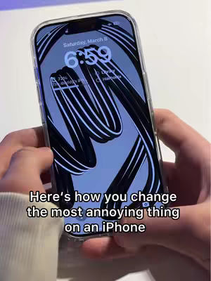 The image shows a hand holding an iPhone, presenting the lock screen with a patterned wallpaper. Overlaid is a text indicating the video's purpose.