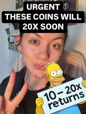 A young woman with brown hair and earrings is positioned in front of a cluttered backdrop. She is making a kissing face while holding up the three fingers on her left hand and a sign with '10 - 20x Returns' written by Homer Simpson.