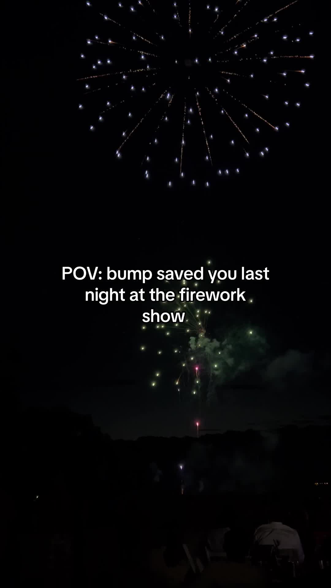 A night sky filled with bursting fireworks, with text overlaid in the center stating, 'POV: bump saved you last night at the firework show.' The fireworks are various colors, and the overall scene suggests a lively outdoor event.