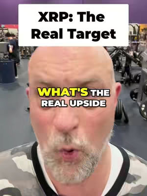 A man with a shaved head and a beard is centered in the frame, speaking in a gym setting. Text overlays are positioned in the upper and lower parts of the image.