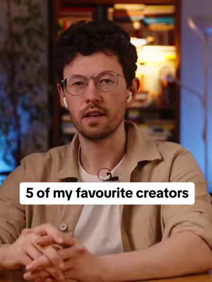 A man with glasses and earbuds is in the foreground, with a text overlay that says '5 of my favourite creators'. Behind him is an out-of-focus background with bookshelves.