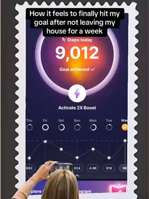 The cover image shows a phone screen displaying a fitness app interface. The screen features a progress tracker indicating 9,012 steps with a goal achieved. Text overlays state, 'How it feels to finally hit my goal after not leaving my house for a week.' The image is framed as if captured on a phone held by someone, with a view of a person's hand and hair, suggesting the creator is sharing their accomplishment.