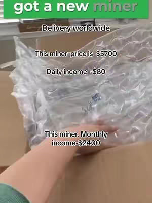 The cover image shows a person's hand reaching into a cardboard box filled with bubble wrap. Text overlays indicate the contents are a crypto mining device, listing the price and potential earnings.