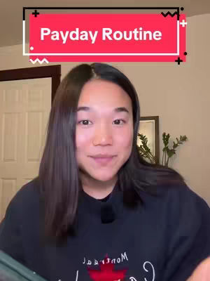A woman with long dark hair in a black sweatshirt is the central focus, smiling gently at the camera. A red rectangle with white text 'Payday Routine' overlays the image. The background is a softly lit interior.